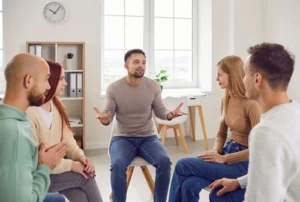 Image of a supportive group therapy session at a Durham substance abuse treatment provider focusing on overcoming substance use disorder and sharing experiences with withdrawal symptoms.