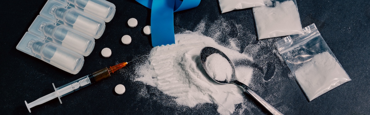 Illegal drugs, including cocaine and pills highlighting the severity of addiction before entering rehabilitation treatment programs.