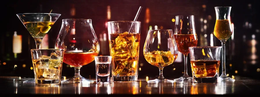 An array of alcoholic drinks are representing an alcohol rehab center.