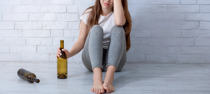 A woman needs to go to an alcohol rehab center because of her drinking problem.