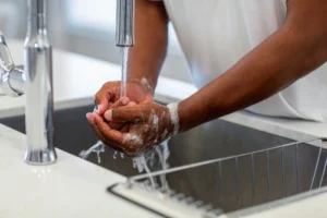 Image of a young adult struggling with OCD symptoms and addiction, highlighting the co-occurrence of obsessive compulsive disorder and substance use disorder.