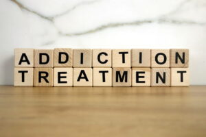 Wooden blocks spell addiction treatment.